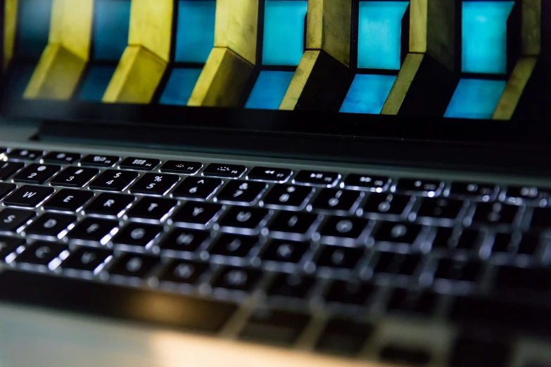 a keyboard has a colorful design in the background