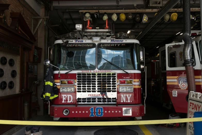 two fire trucks parked in a fire station