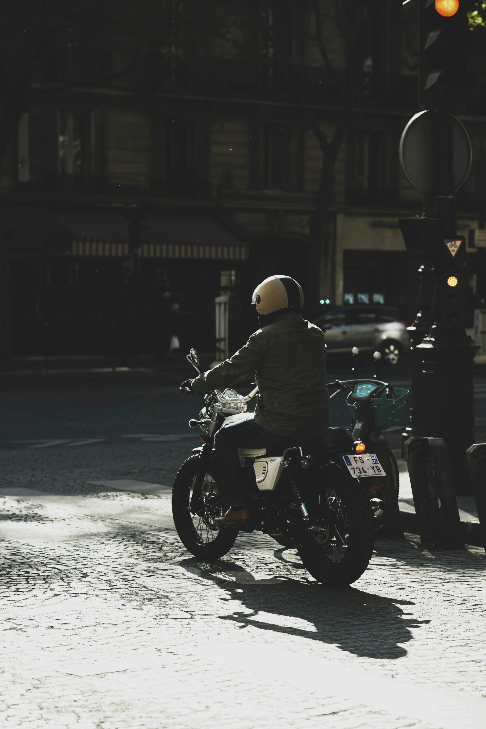 a person riding a motorcycle on a city street