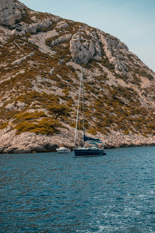 there is a large blue boat sitting in the water