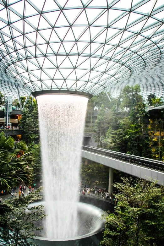 a waterfall is shown in the center of a pond