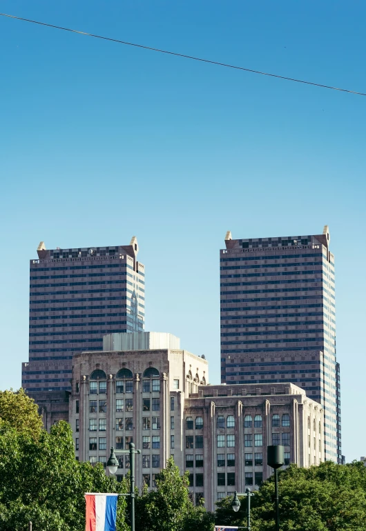 an image of some very pretty buildings that are near a park