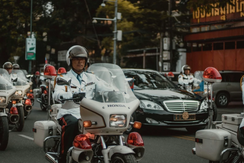 the police officer is riding his motorcycle in traffic