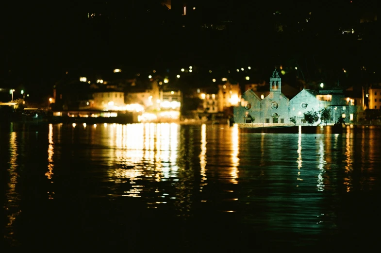 the house on the water has bright lights in it