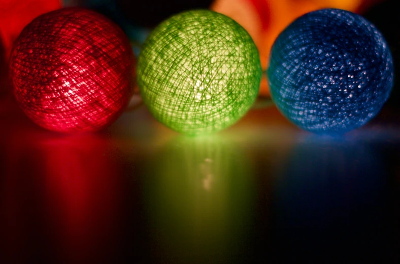 several balls that have different colored lights in them