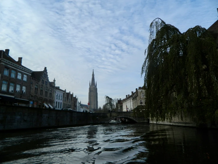 a waterway in an old european city on a cloudy day