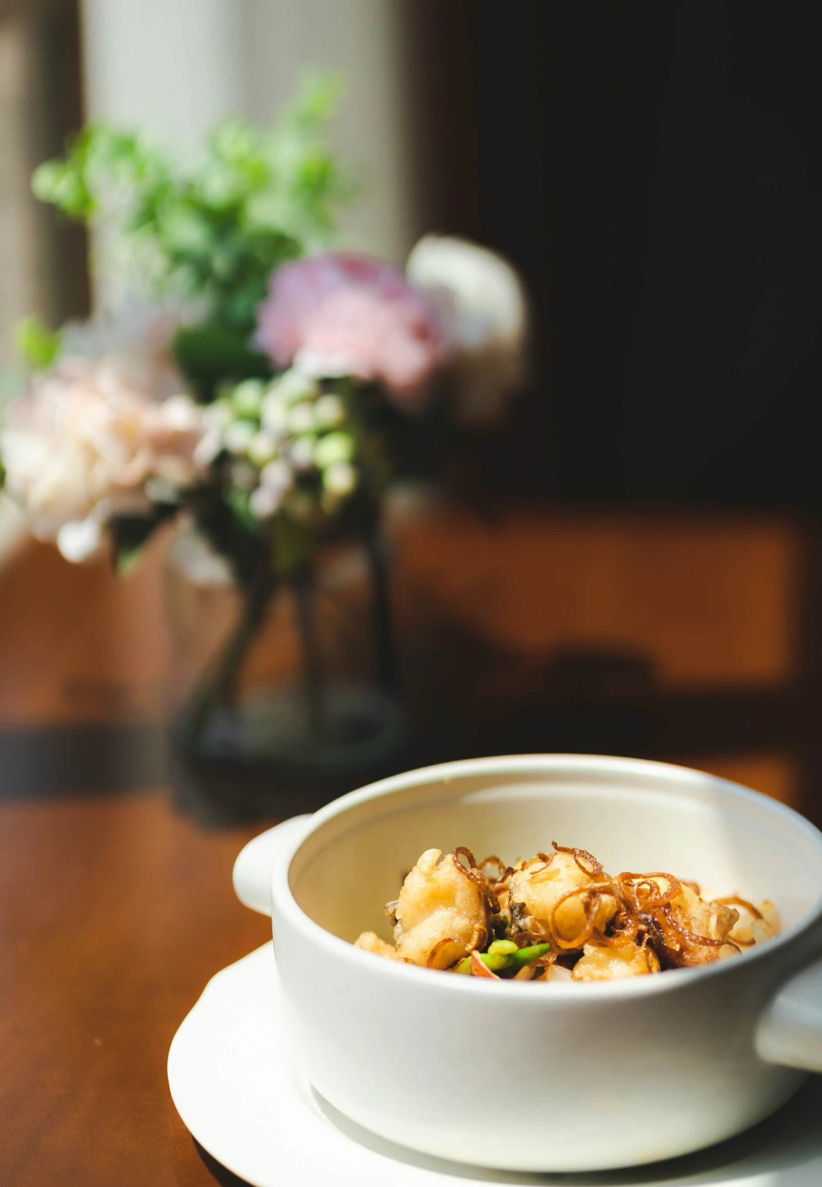 a bowl with food on it sitting on top of a plate