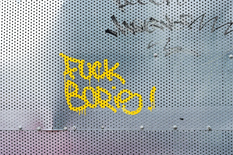 a yellow sign on a frosted window