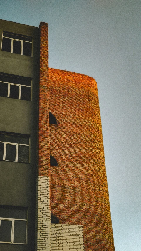 a tall building with lots of windows and a clock on it