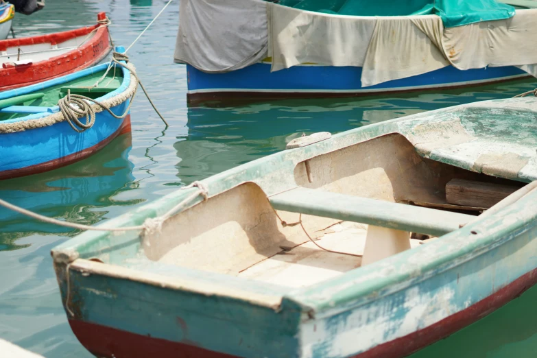 three small boats tied up near one another
