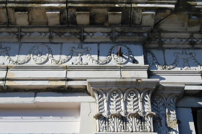 a stone building features an intricate carving