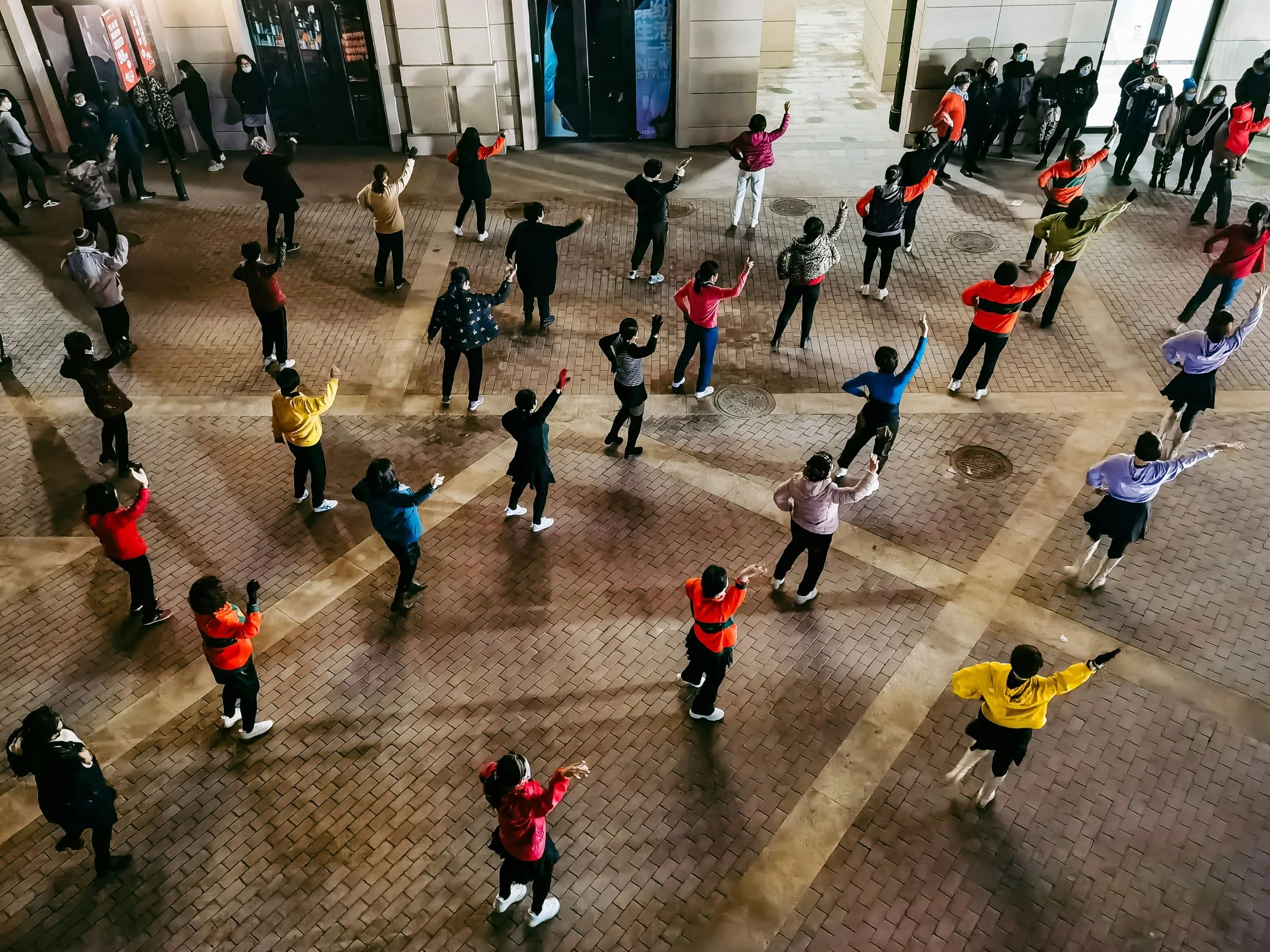 an aerial view of a large group of people in the city