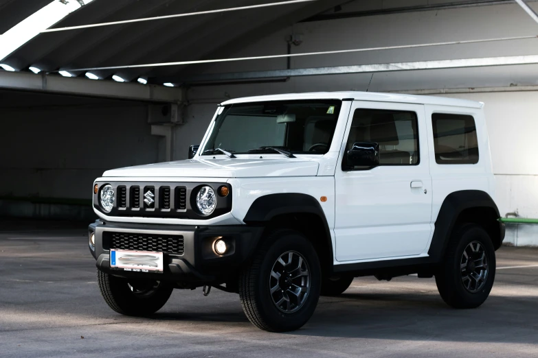 a white colored jeep parked in a parking space