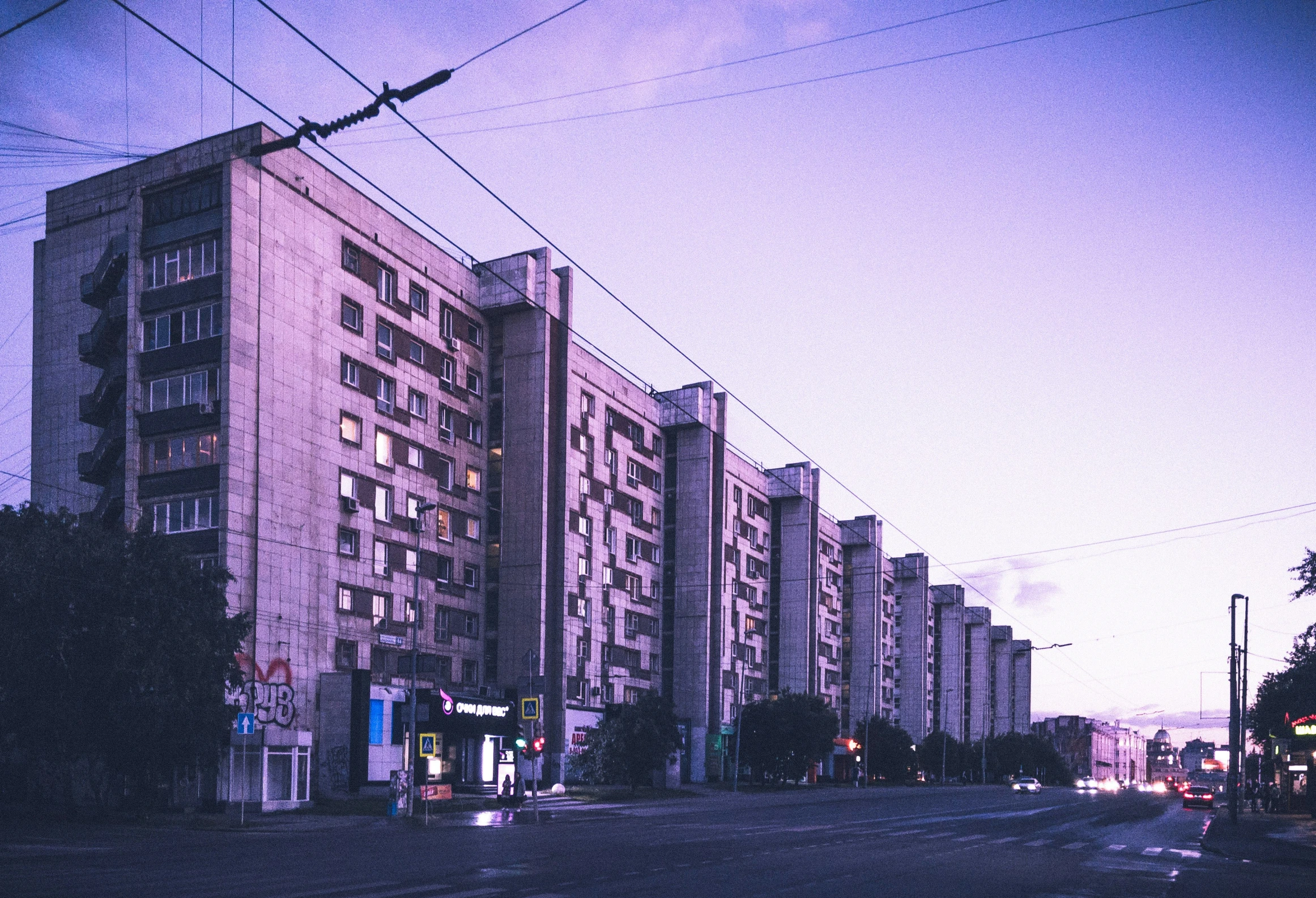 large building in the distance in front of traffic