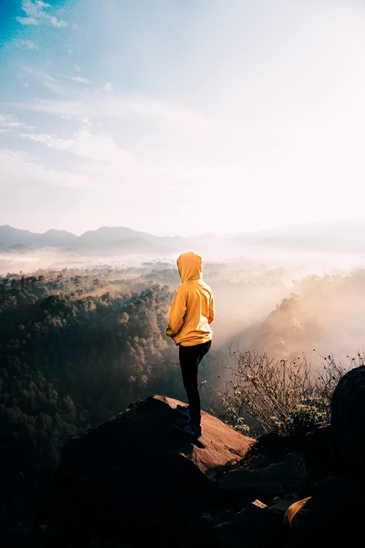 a person is taking a walk on top of a rock