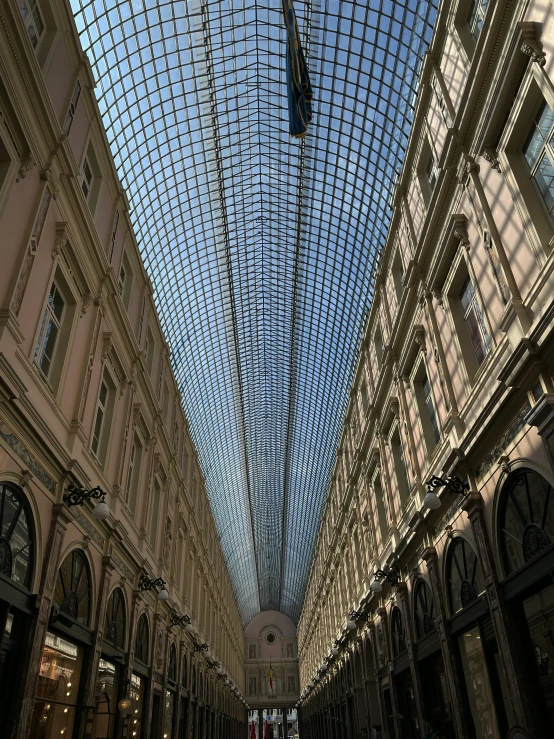 an empty shopping mall has a huge glass skylight