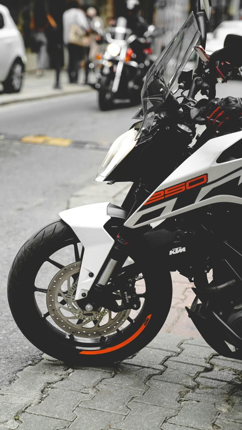 a motor bike parked on the side of a city street