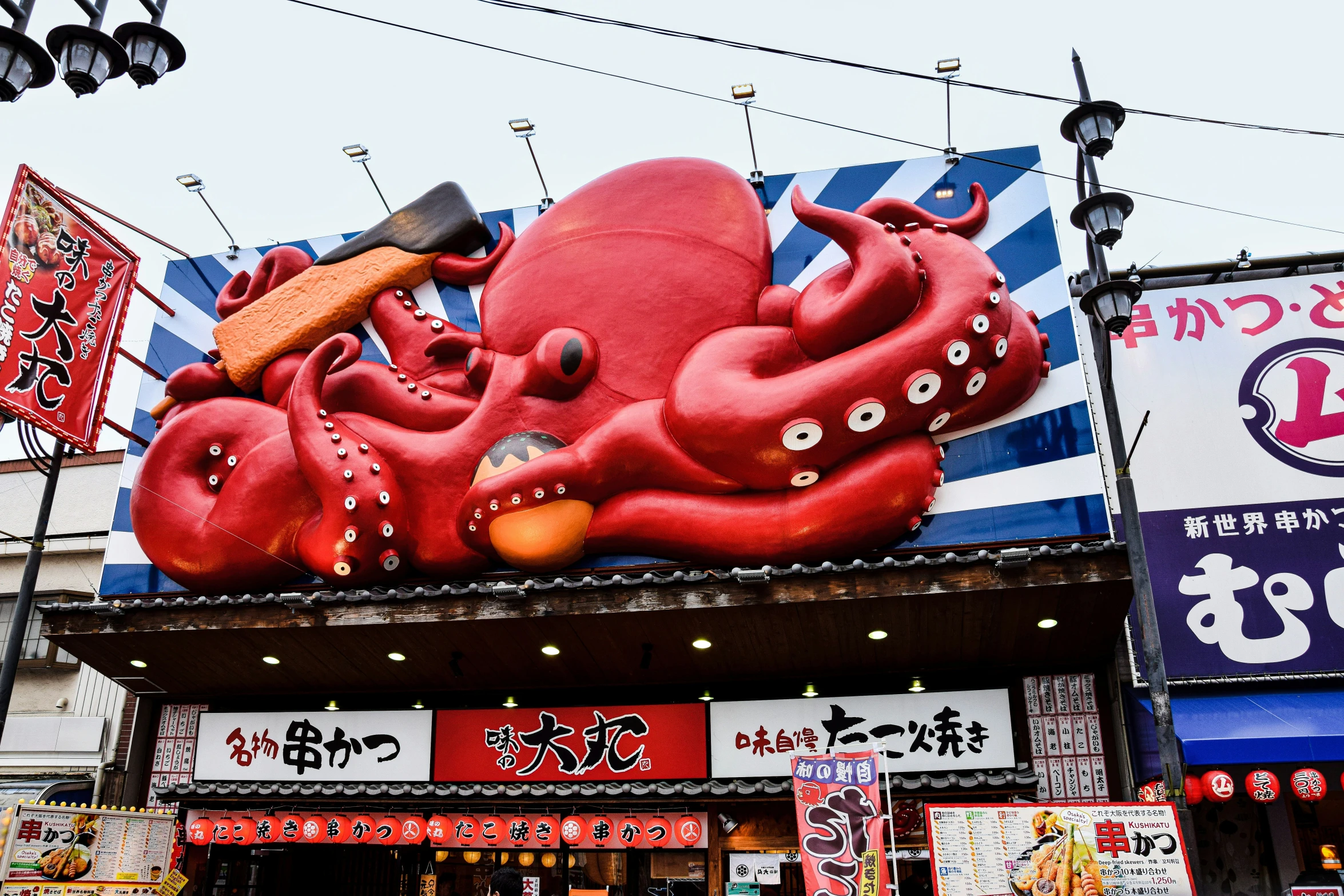 a giant colorful octo is shown on the side of a store