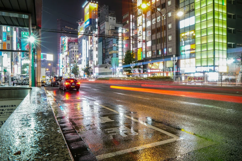 a city street filled with lots of traffic at night