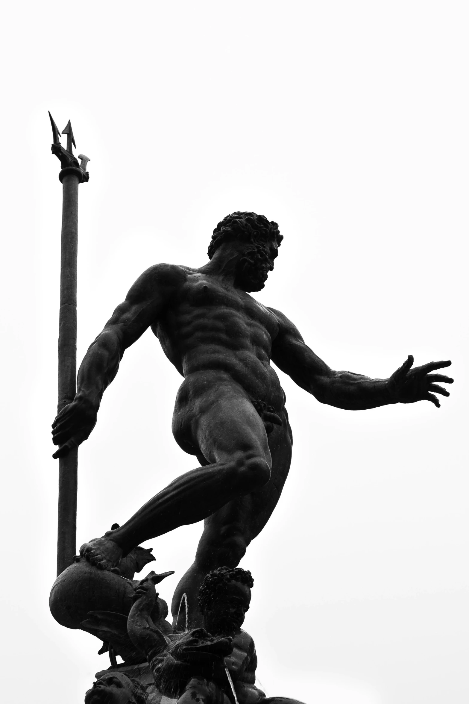 a statue of a man on top of a pole