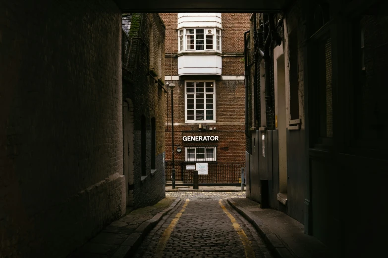 a small alley leading through to a brick building