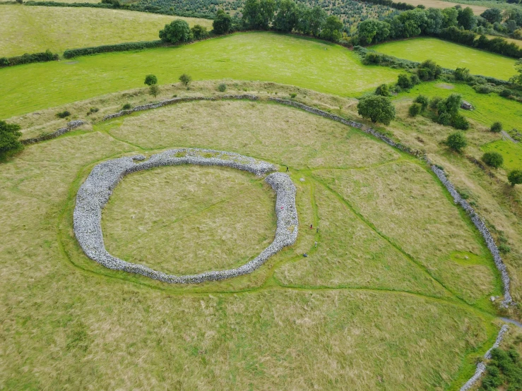 an aerial view of the ruins of a farm