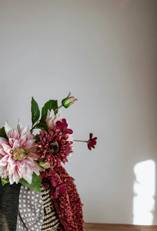 there is a basket with flowers inside it