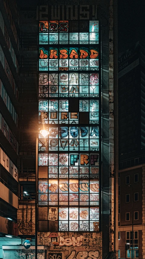 large glass block in an old warehouse, surrounded by windows