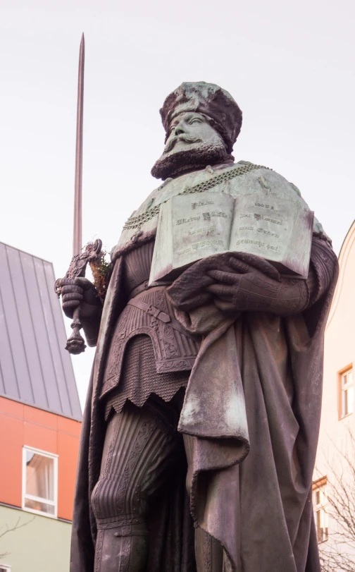 statue of a person with a sword on a white background