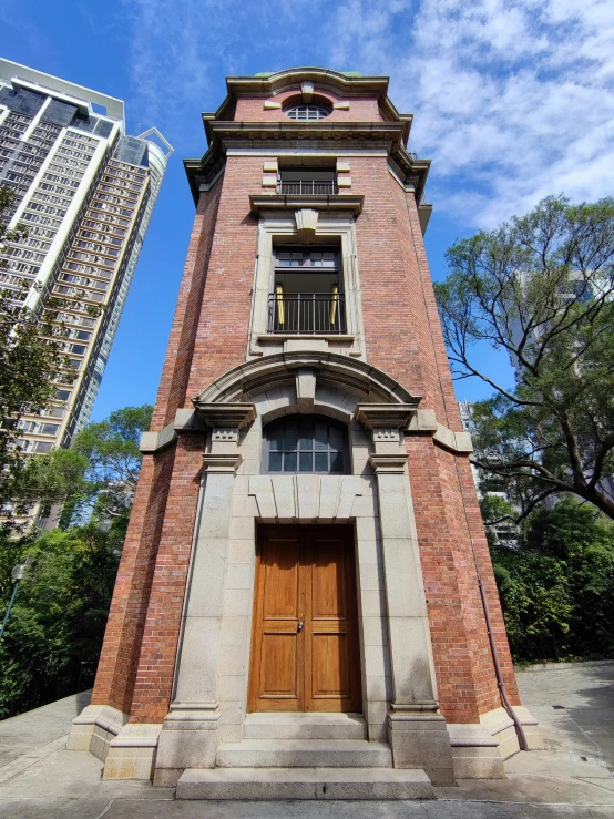 a tall tower with a window and a door