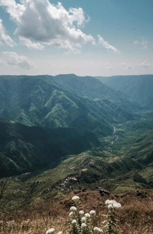 a picture taken from the top of a mountain with mountains in the background