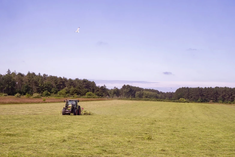 the tractor is in the middle of the field