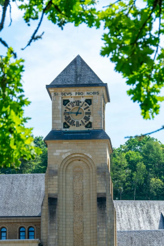 the clock tower is on the side of a building