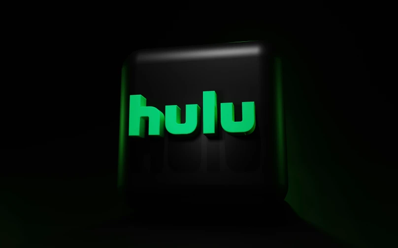 a green illuminated box in the dark with the words uhlu