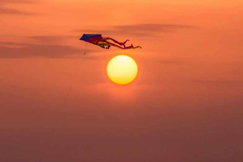 a kite flying high up in the air