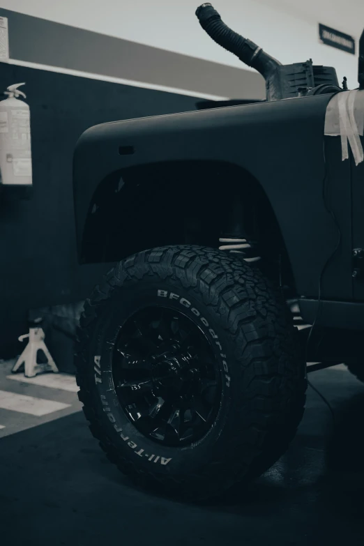 an off - road jeep with a bow tied on its roof