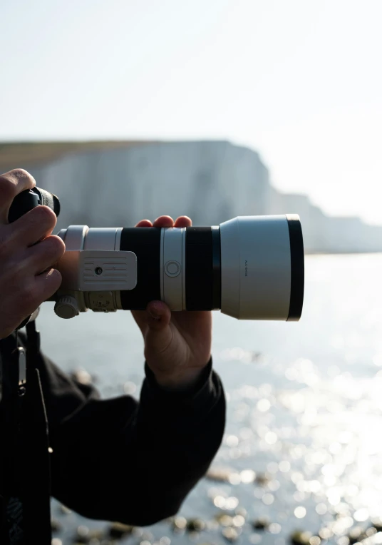 a pographer with a canon camera taking pictures