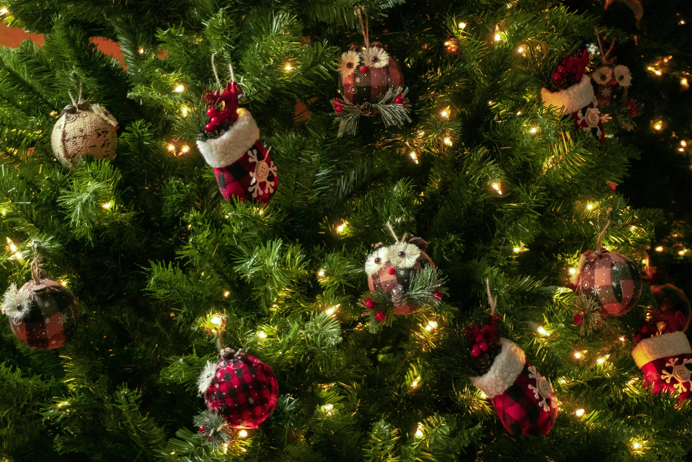 christmas ornaments are hung on the christmas tree