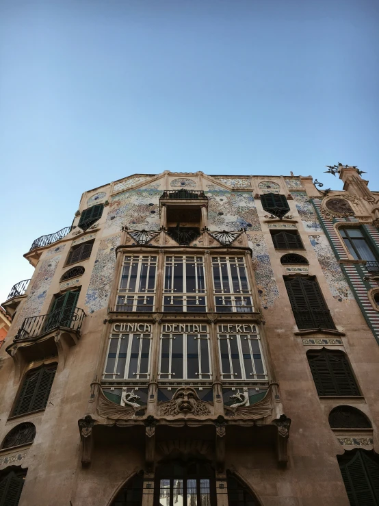 an ornately designed building with several windows