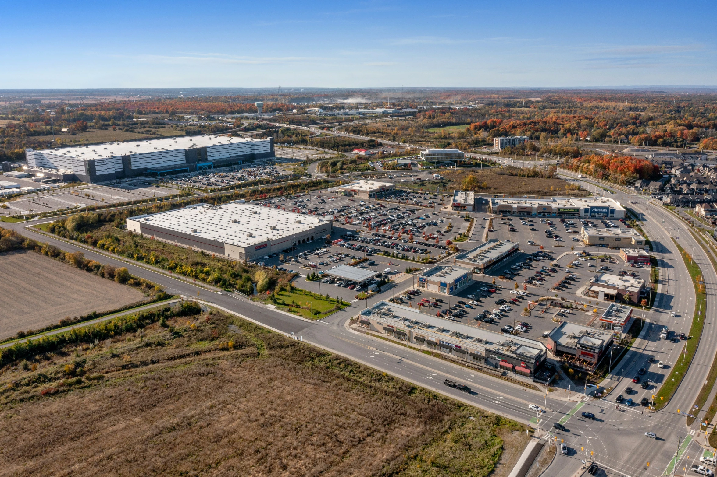 the aerial view of a industrial district near an airport