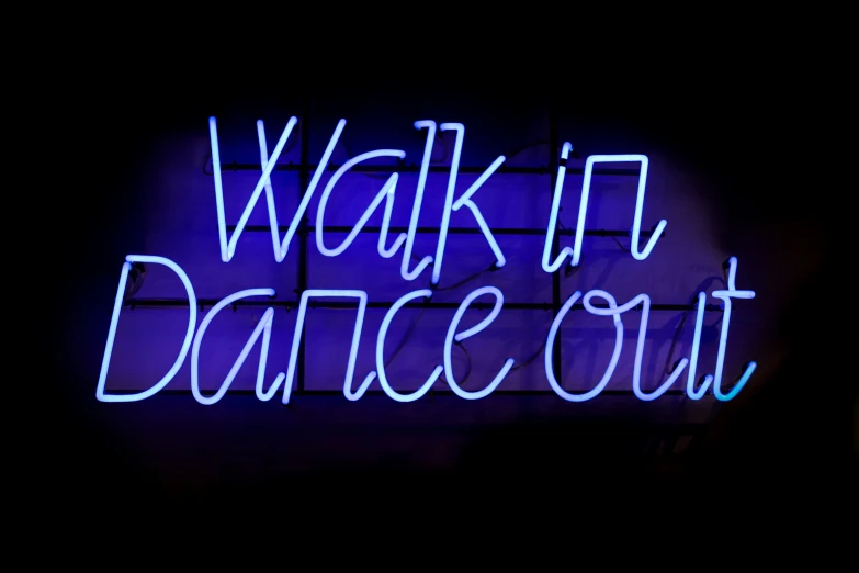 a neon sign that reads walk in dance out