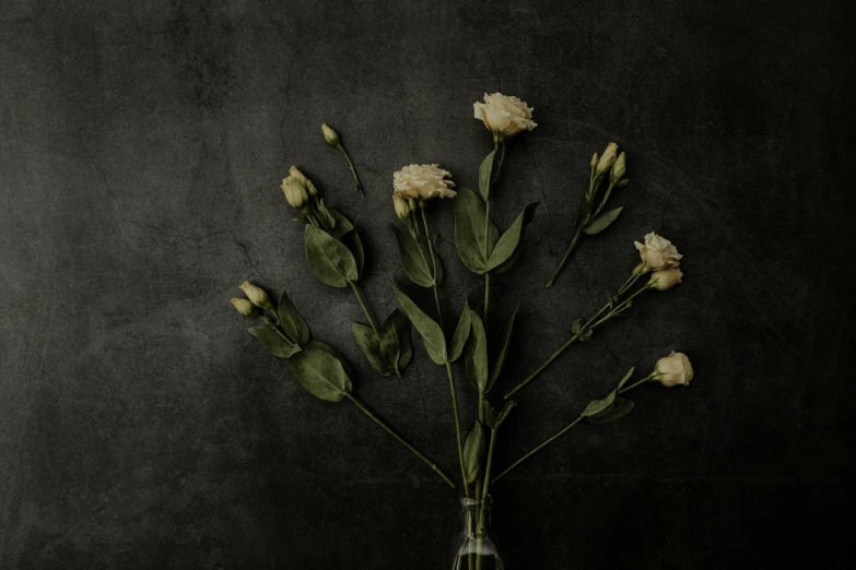 the flowers are arranged in the vase on the table