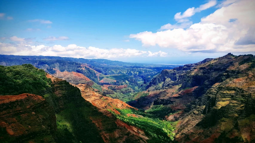 view from above of a mountainous region and valley