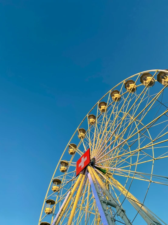 a large ferris wheel against a blue sky