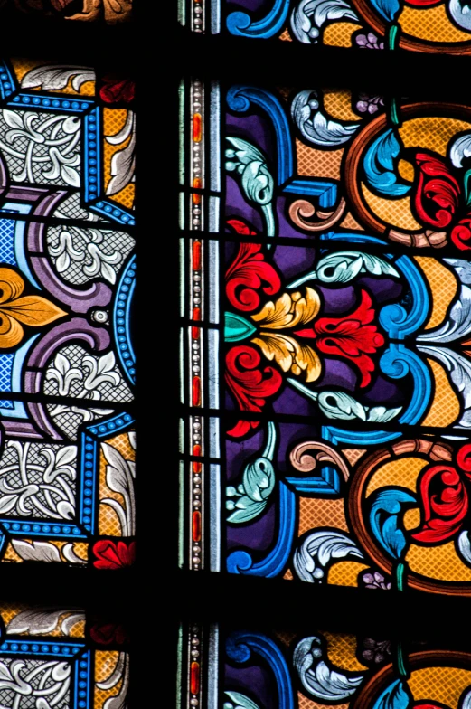 a stained glass window with different designs on it