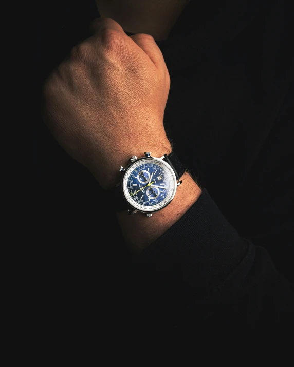 a man wearing a watch with a big celet