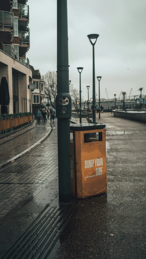 a dirty crate sitting in front of a street sign