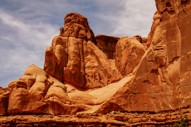 a view of rocks, trees, and shrubs from a distance