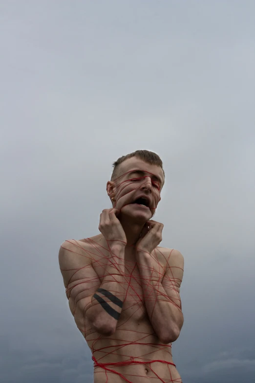 a man standing in the water while looking at soing