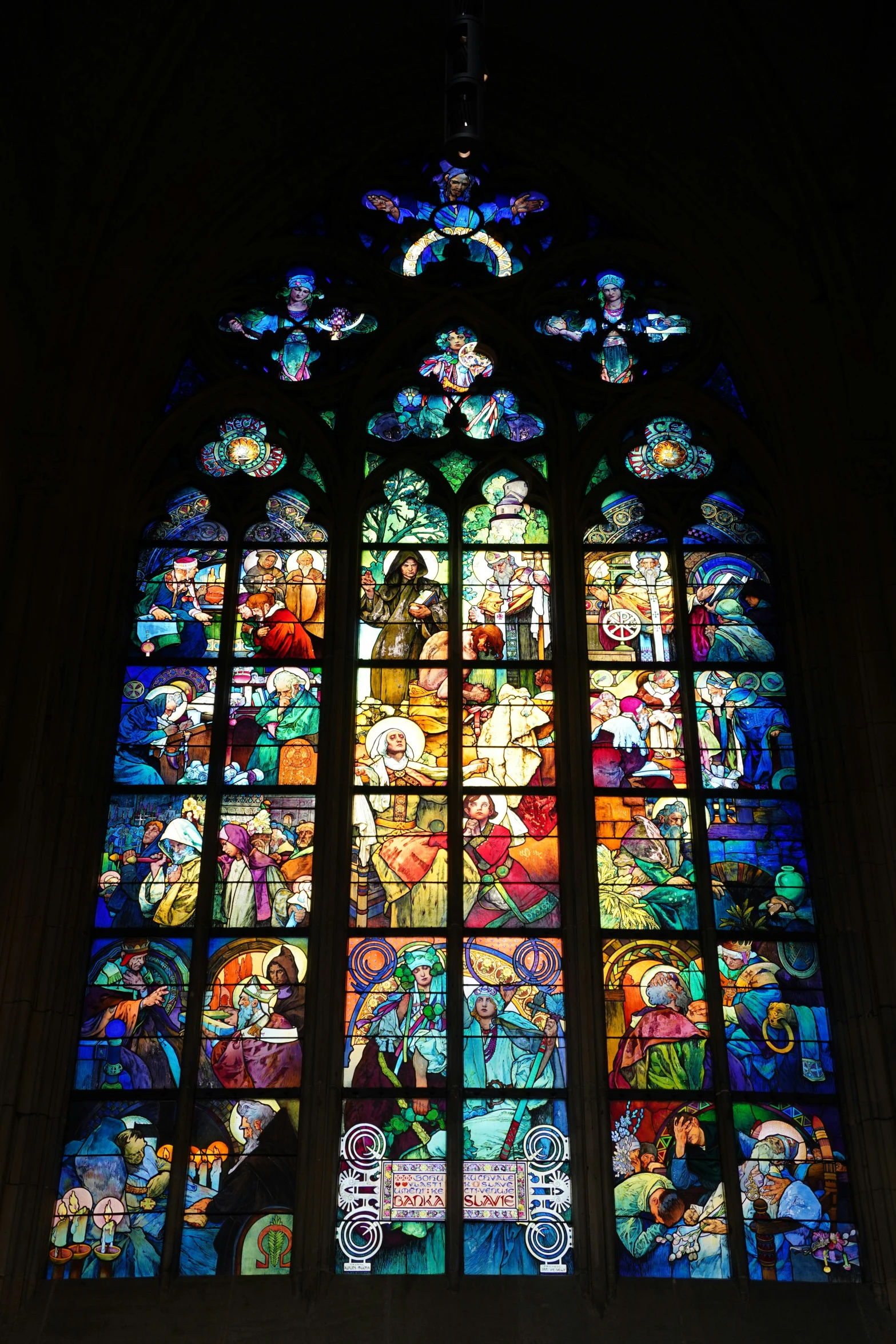 there is a big stained glass window inside of a church